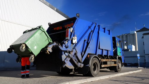 Demolition workers managing waste removal in Marylebone
